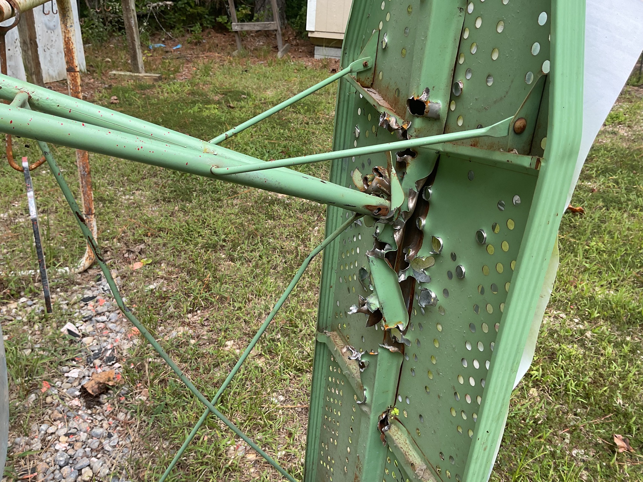 tore up ironing board target holder.jpg