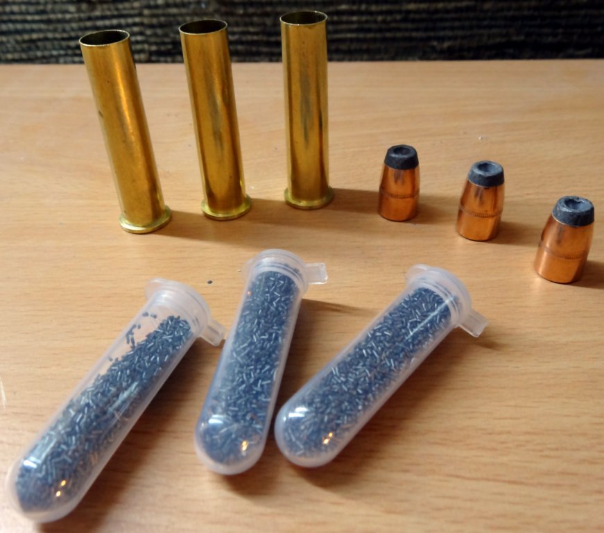 powder cases and bullet.JPG