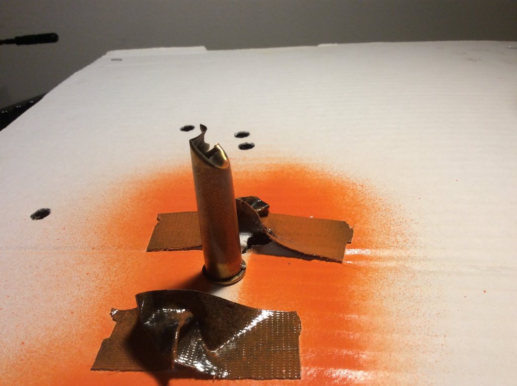 45-70 case target shot with Henry .357 rifle from 50 yds. open sights.jpg