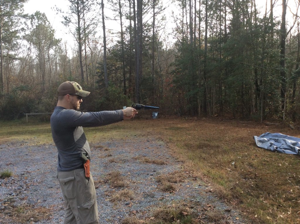 Chad prepares to shoot the Remington 1858 with a .45 Colt BP load.jpg