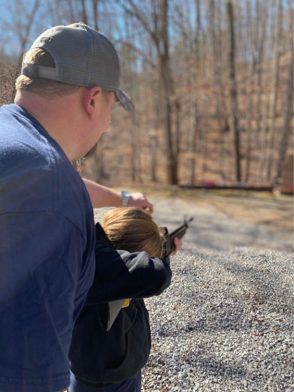 Dave training daughter to shoot..jpg