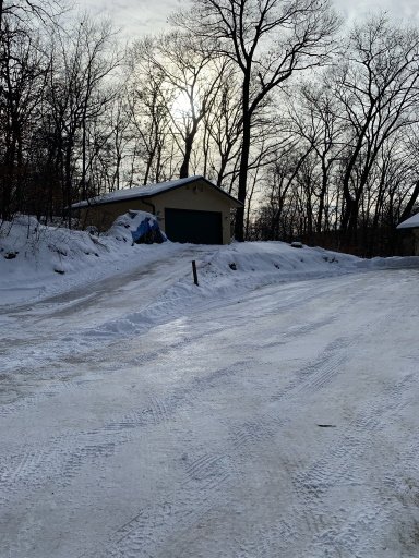 My shop on the hill to the left of the house. Heat and AC.