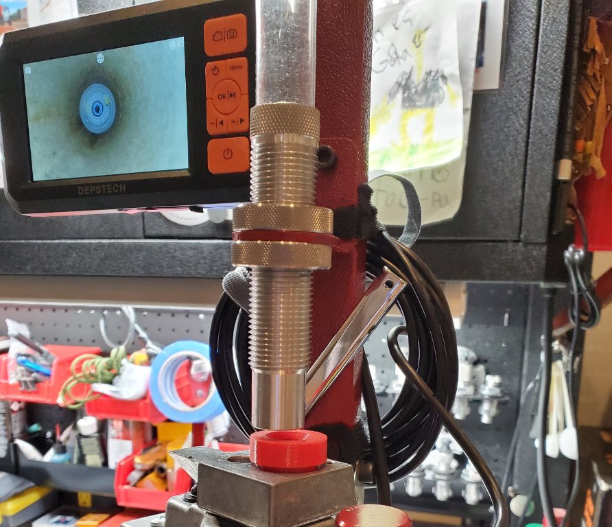 The image on the monitor is looking down a 12 Gauge Federal shotgun hull
