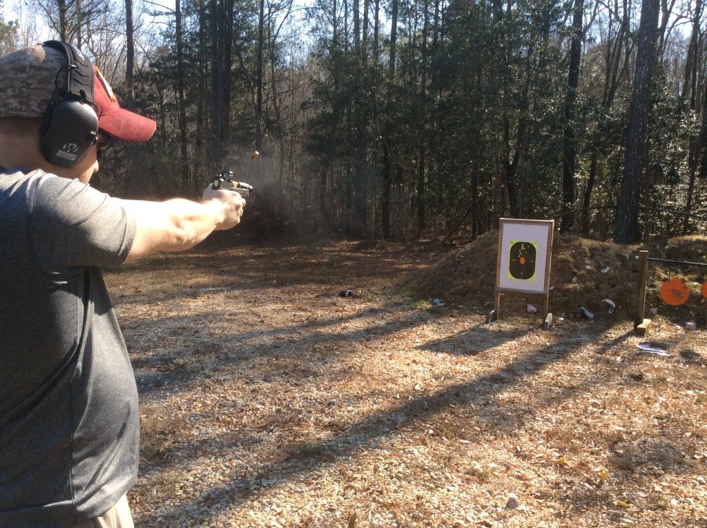 Chad dialing in new green dot sight on Sig P365.jpg