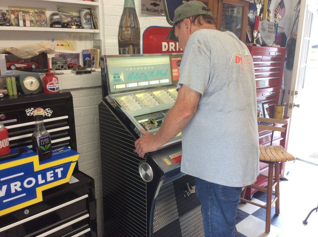 puching up some 60's music in new old juke box.jpg