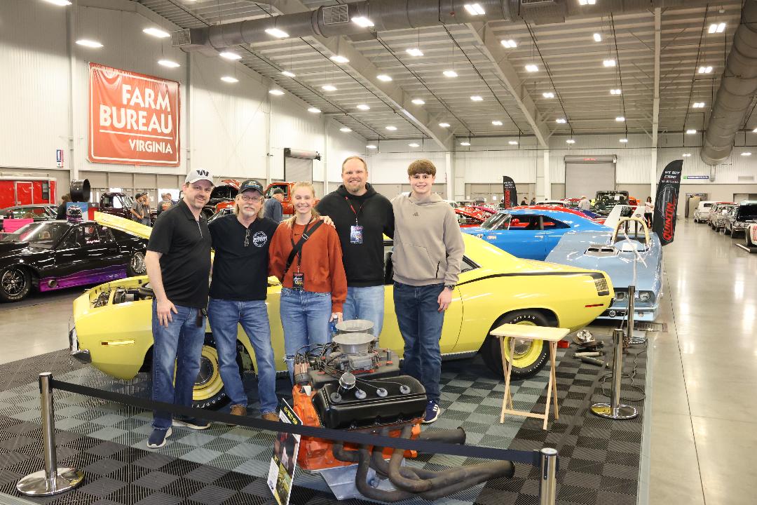 the Strum family with Tommy's 1970 Hemicuda.jpg