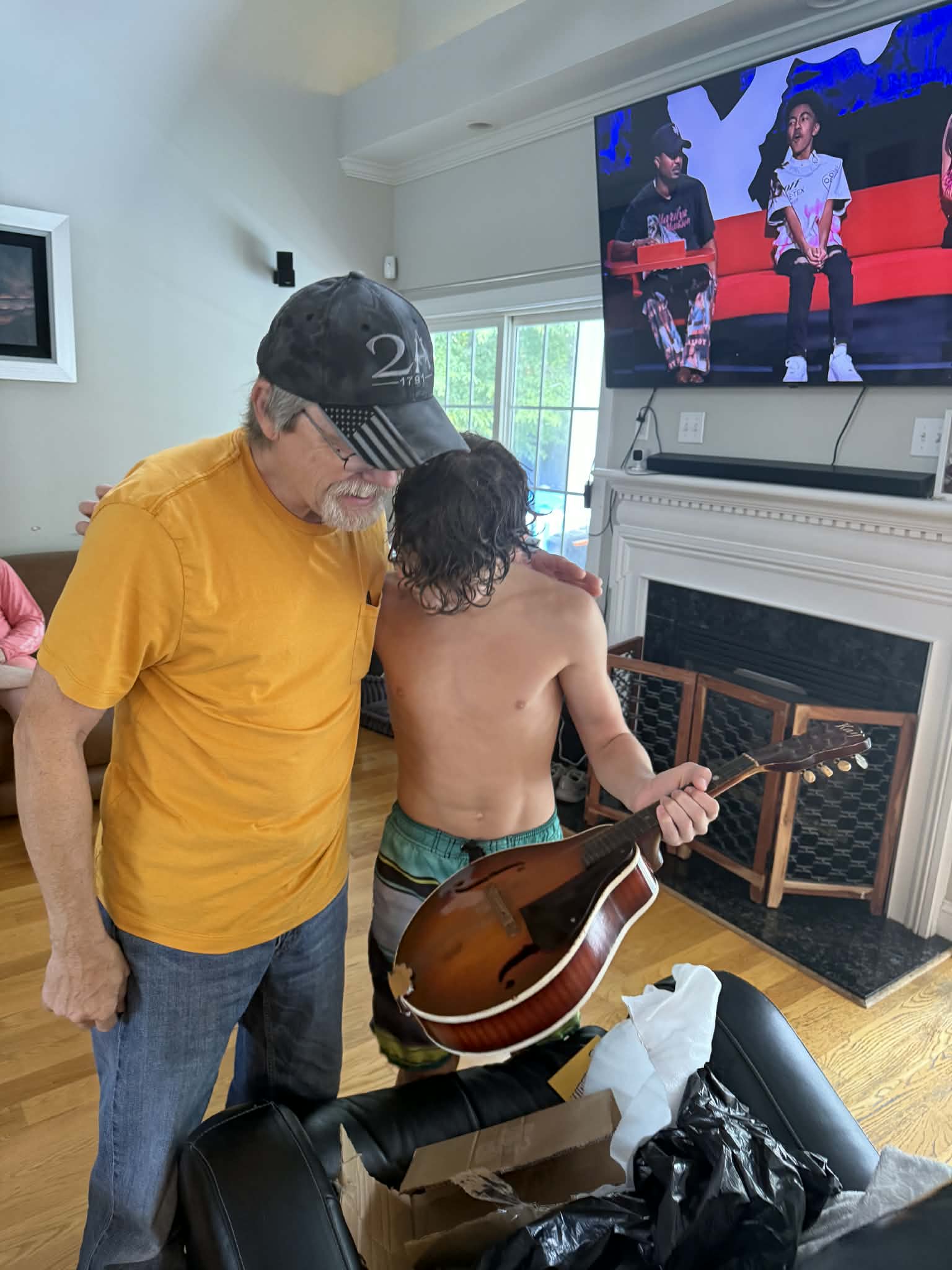 giving my grand nephew my Dad's favorite mandolin  passing on tradition of playing mandolins and guitars.jpg