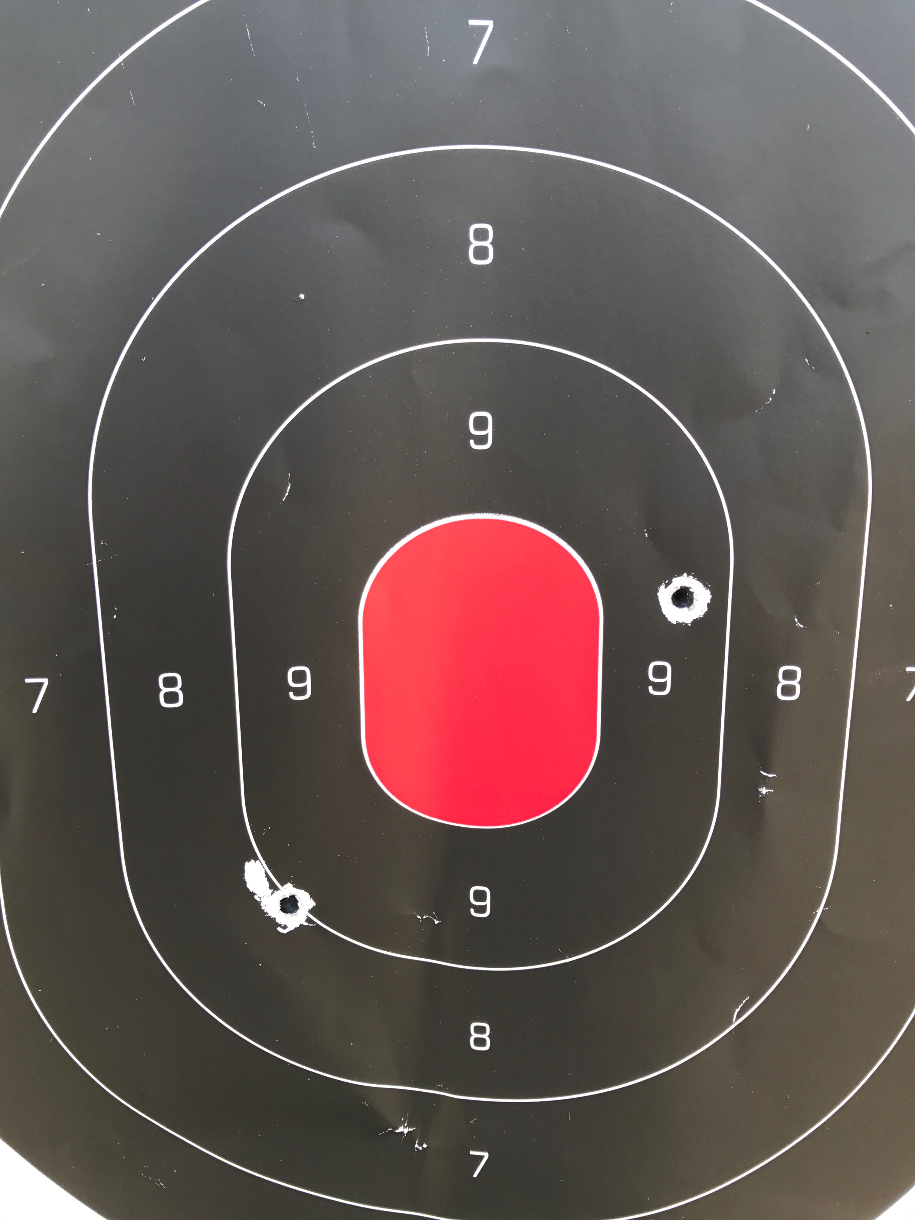 Off hand, standing from 53 yards with a larger center target (2 5/8 x 3 1/2"); I thought 3 shots were taken.